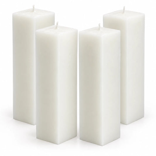 Four white rectangular pillar candles arranged in a group on a clean white background.